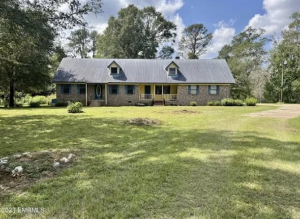 Brick country home with fresh exterior trim paint